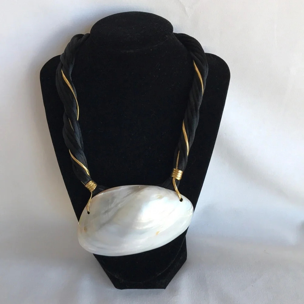 White, black, and gold shell statement necklace